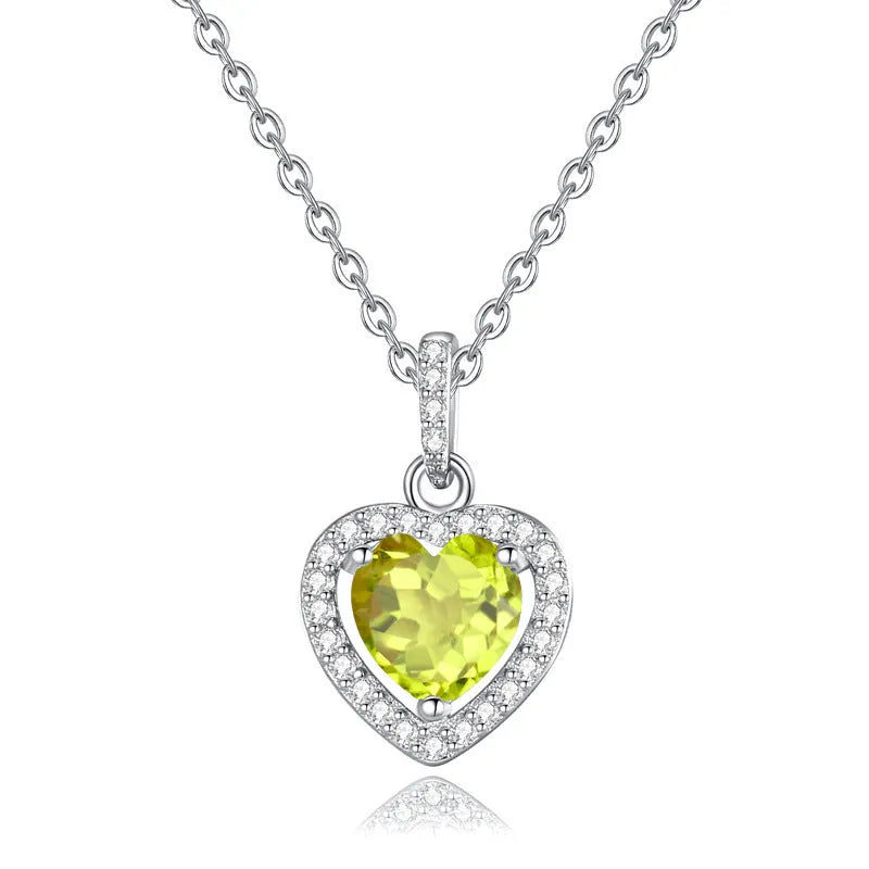 Sterling silver heart pendant necklace with a natural coloured gemstone on an adjustable cross chain.