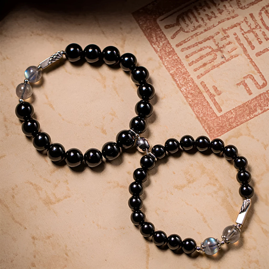 Obsidian couple bracelet DIY set with 8mm and 10mm Buddha beads on adjustable string.