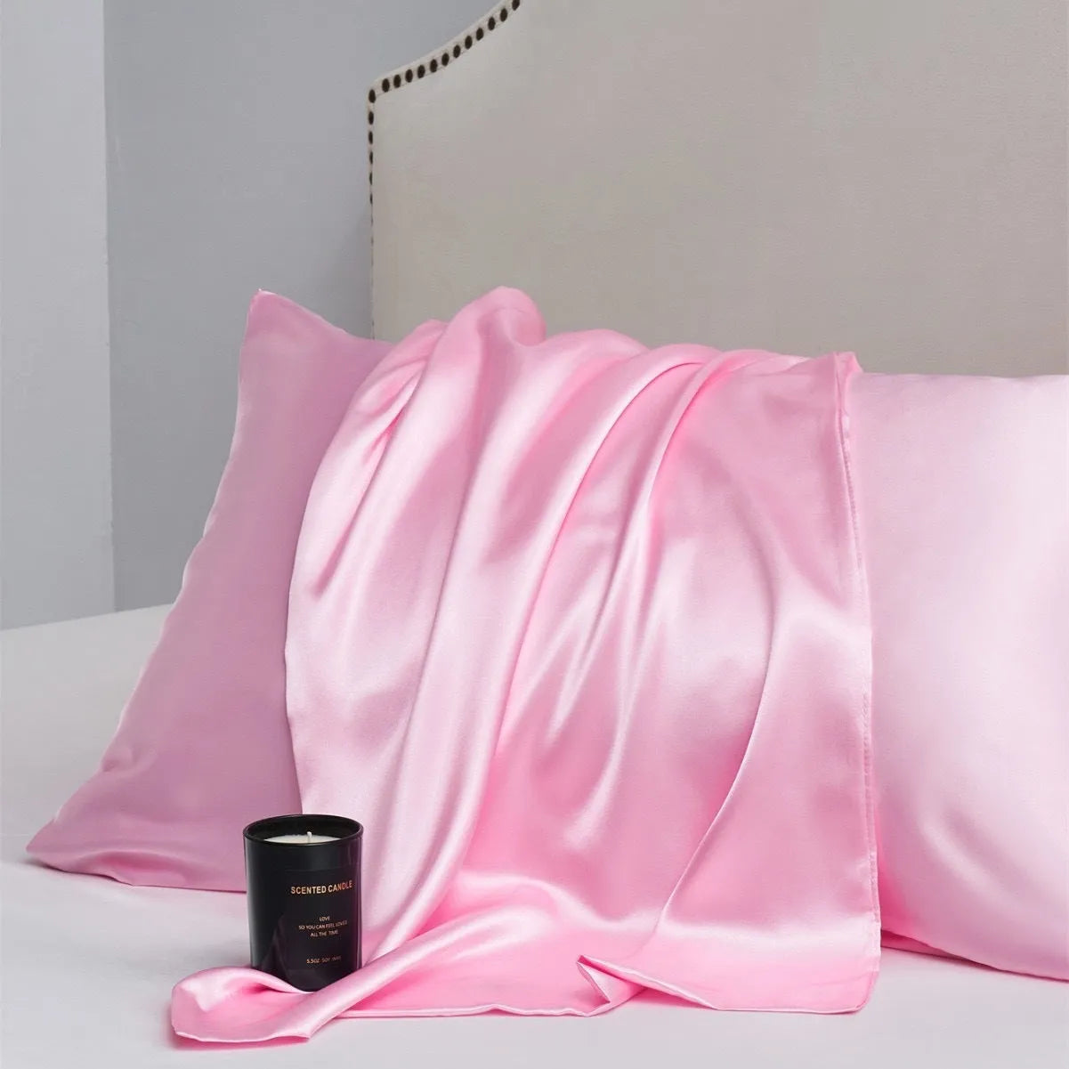 Pair of solid colour satin cloth pillowcases showing colour options including navy blue, wine red and light pink
