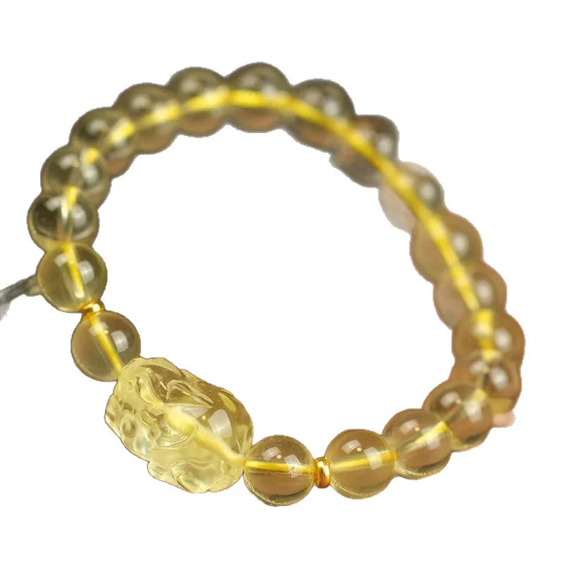 Yellow artificial crystal Pi Xiu bracelet on a leather cord in Chinese national style.