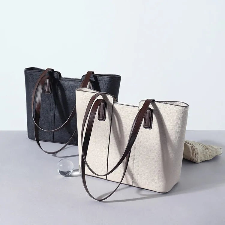 Women's genuine leather shoulder bag in khaki colour showing box-type design and organised interior compartments