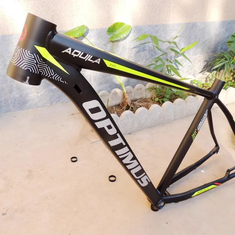 Black and green 29-inch aluminum mountain bike frame with internal cable routing and disc brake mounts
