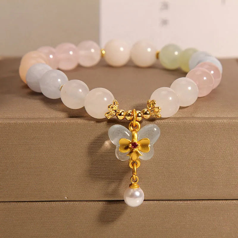 Women's crystal bracelet with colourful morganite butterfly pendant on an adjustable chain.