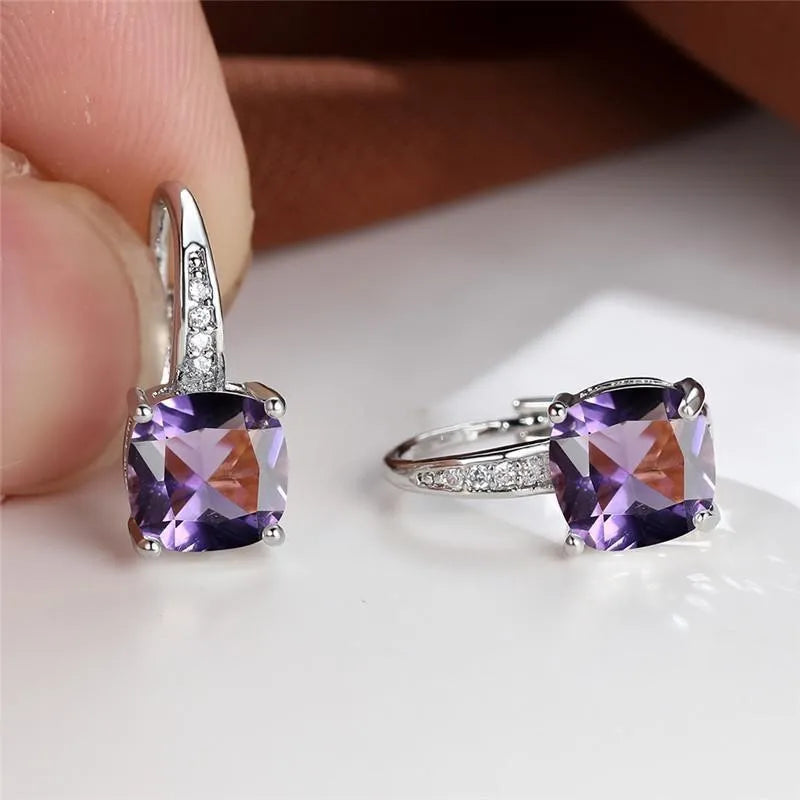 Square geometric ear hook studs with a round zircon stone, shown in a gold electroplated finish.