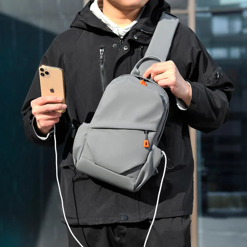 Men's black waterproof polyester crossbody bag with single shoulder strap and simple casual design