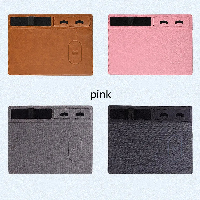 Pink wireless charging mouse pad with phone on charging area and mouse on PU leather surface