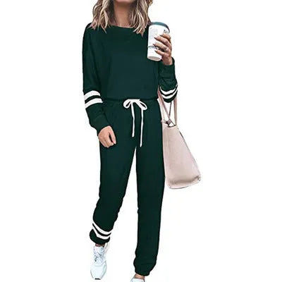 Women's plus size casual two-piece suit set in a solid colour, showing loose-fitting long sleeve top and trousers.