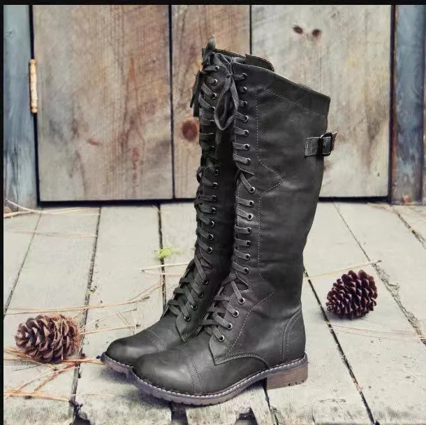 Women's black chunky heel high leg ankle boots with round toe and cotton lining on a white background.
