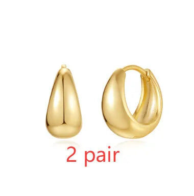Golden brass diamond earclip earrings with geometric round design and butterfly backings