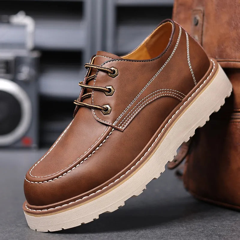 Men's black low-top casual boots with round toe and rubber sole