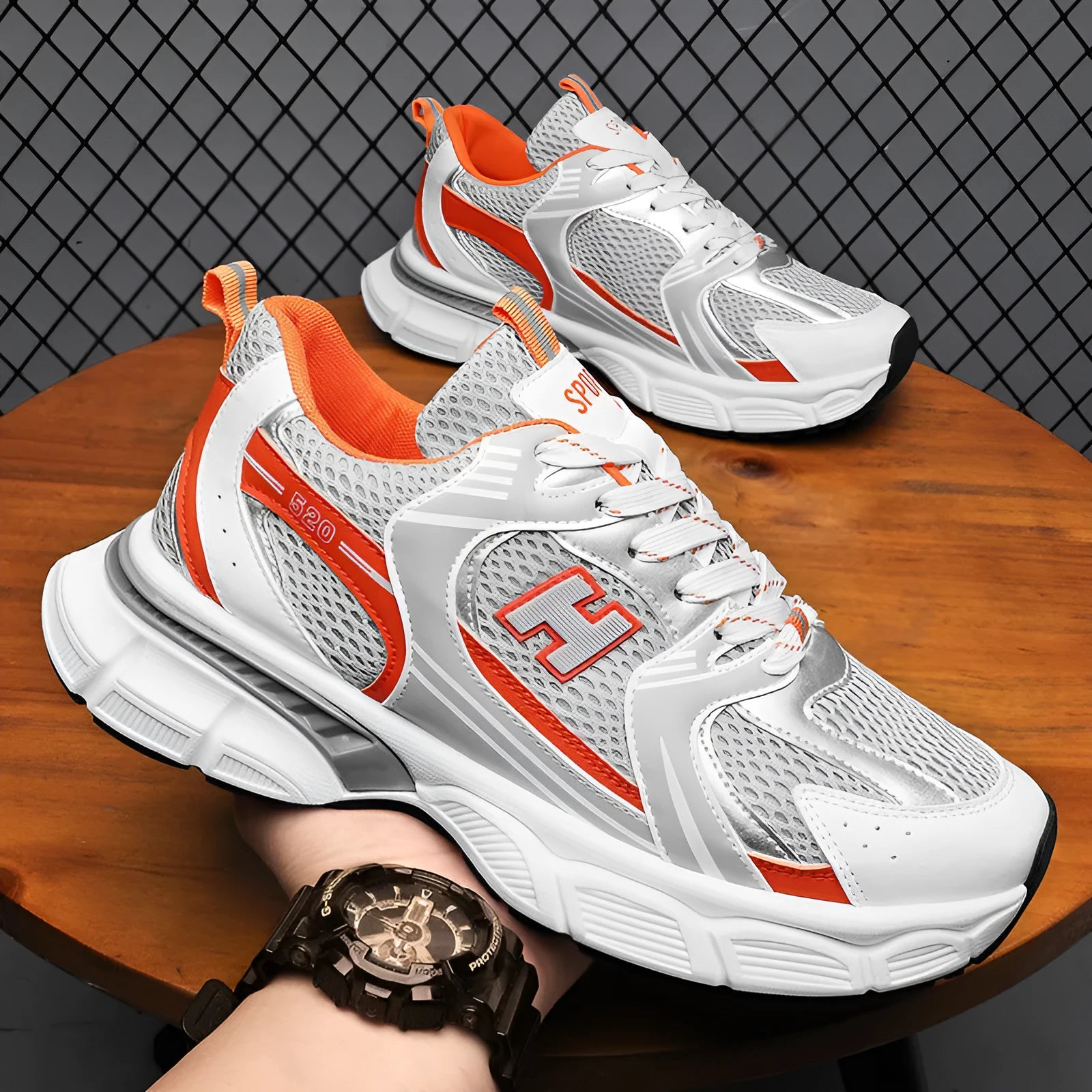 Men's white and grey mesh running shoes with a round toe and plastic sole on a plain background.