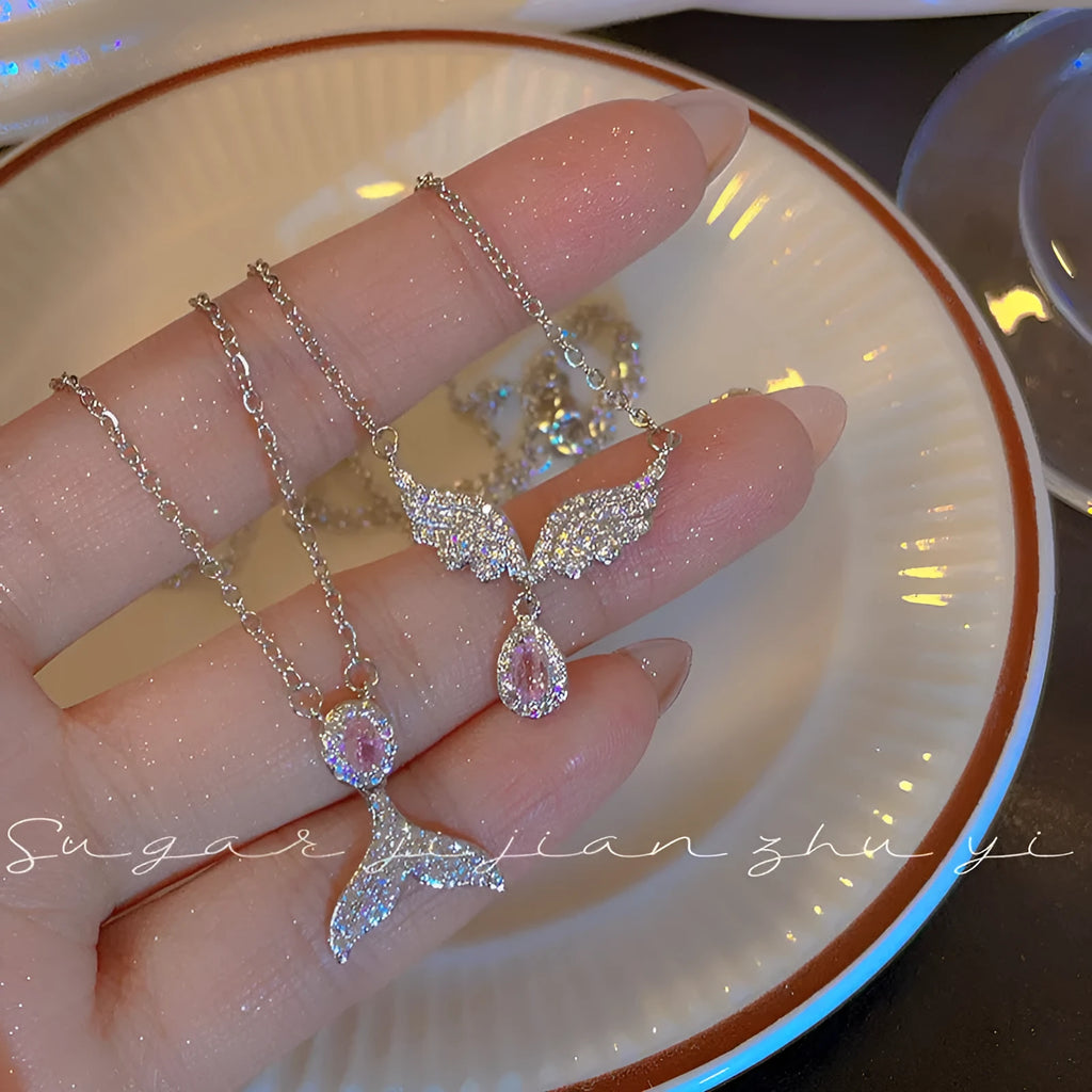 Women's sterling silver necklace with a choice of fishtail or angel wing pendant on an O-ring chain.