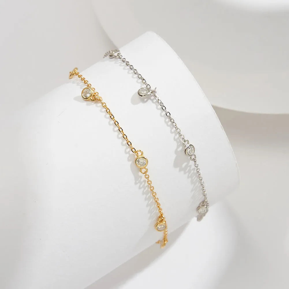 Women's silver anklet with geometric zirconium pendant in gold or white gold finish.
