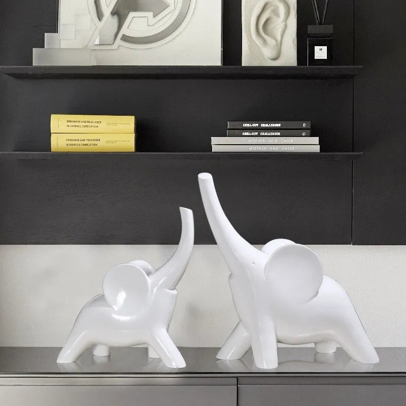 Minimalist solid resin elephant ornament in rose gold on a shelf.
