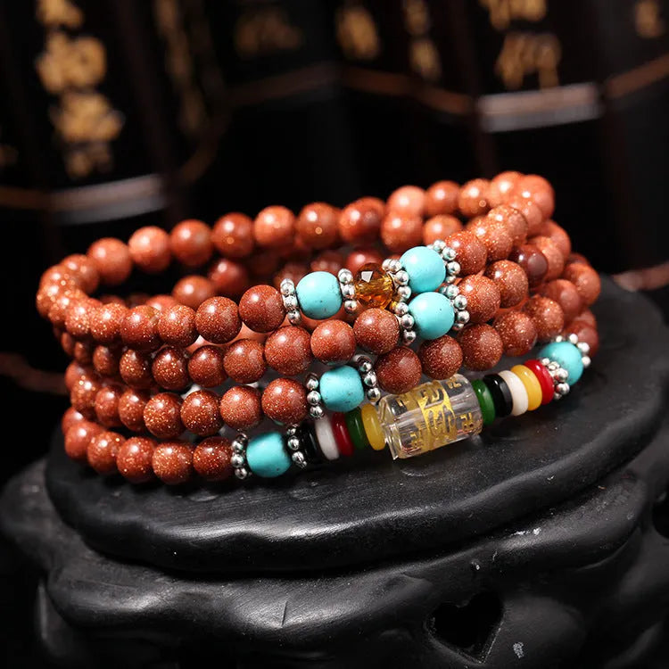 Golden star stone bracelet with 108 nugget sand beads showing fu character and multi-circle design