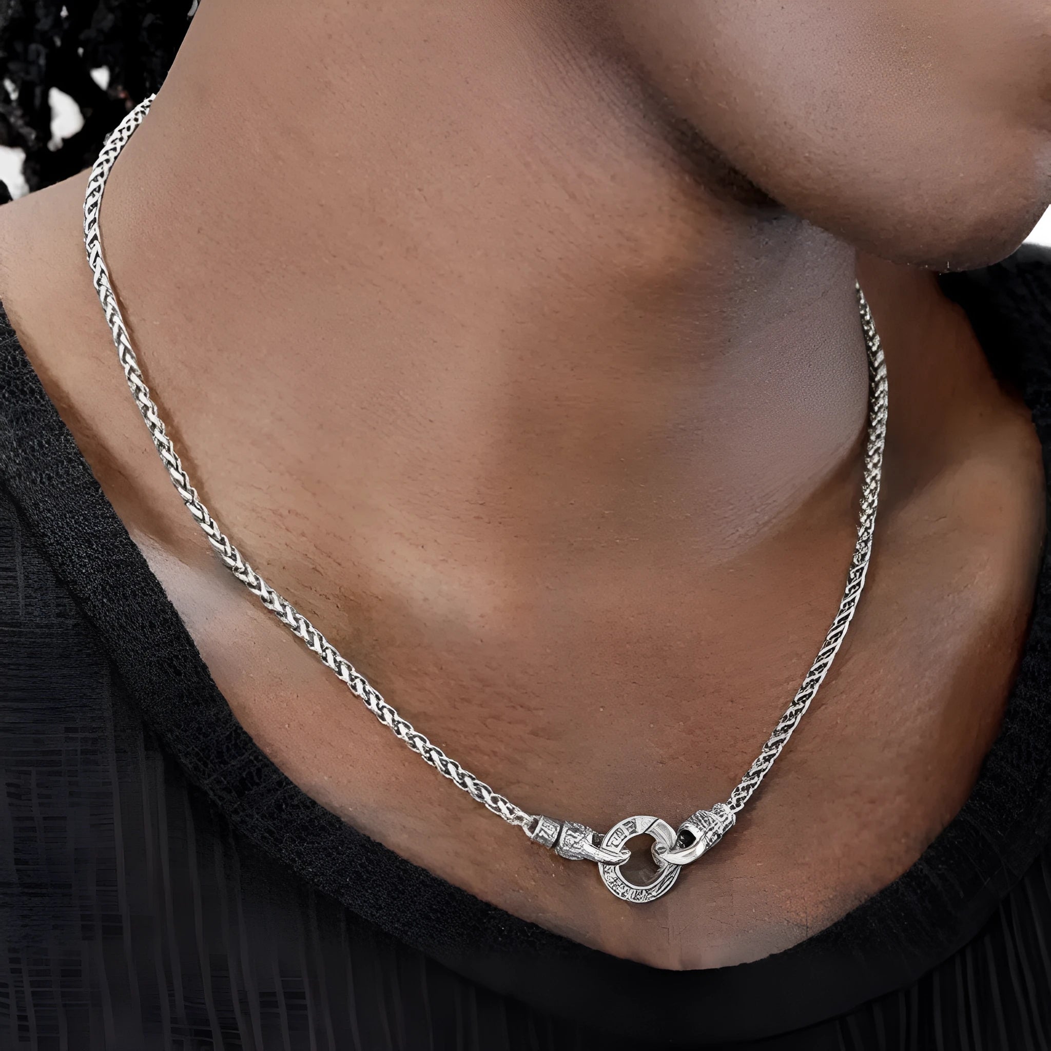 A sterling silver clavicle necklace for women with a minimalist pendant on a delicate chain.