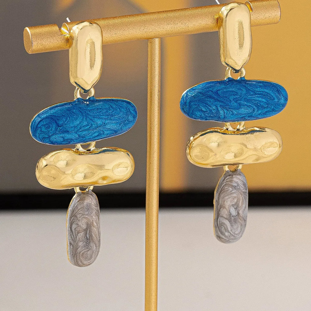 A pair of simple geometric stud earrings with a multicolour electroplated finish.