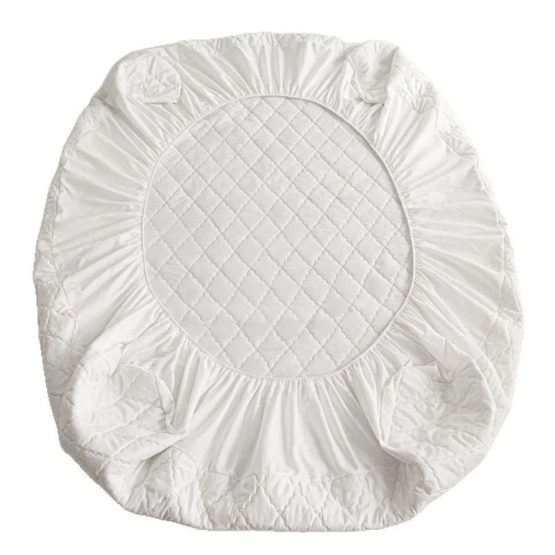 Diamond lattice quilted waterproof mattress protector and pillowcases in a solid colour.