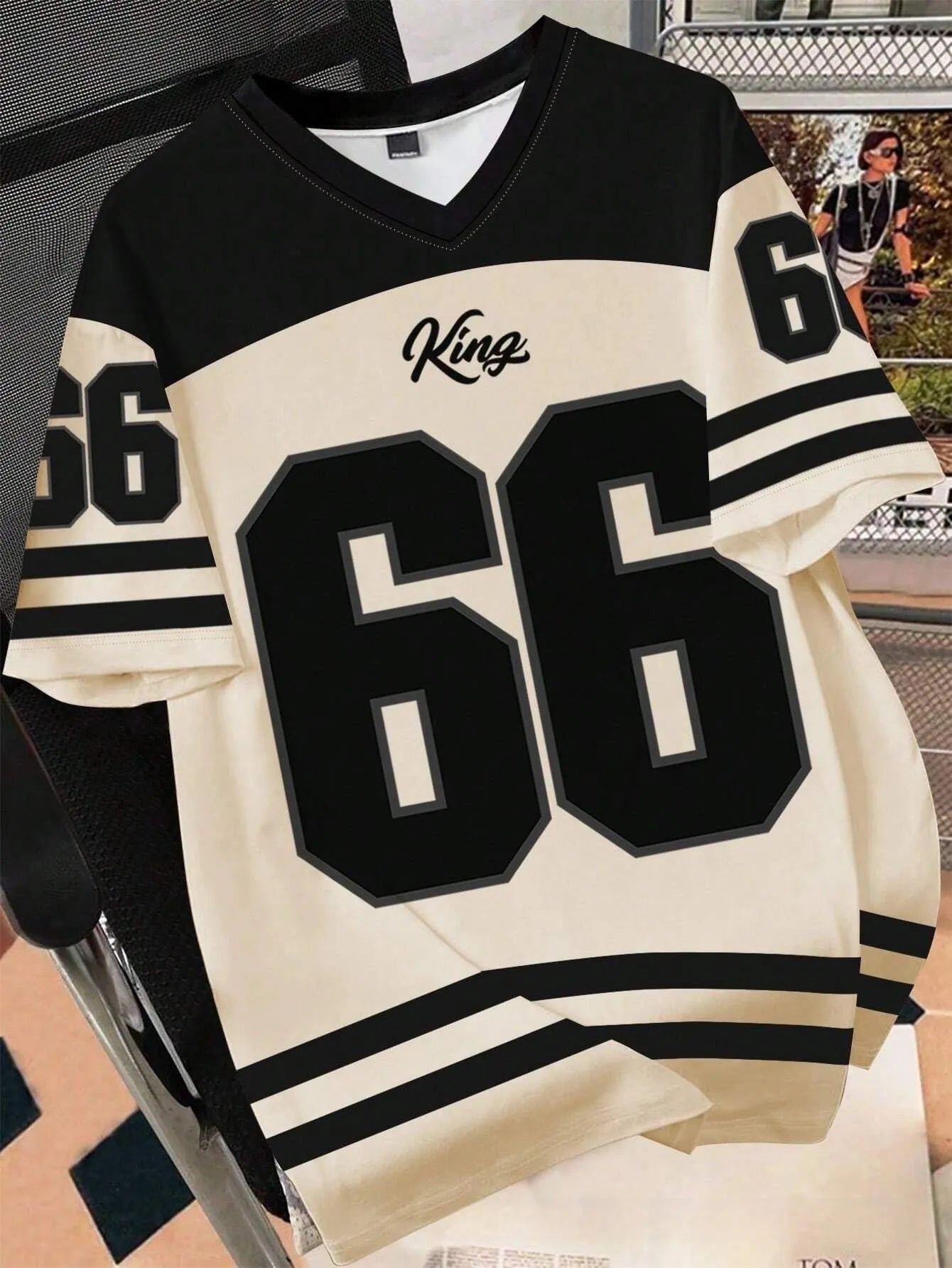 Man wearing a loose fit black t-shirt with a large, colourful 3D printed graphic of Chicago No 23 on the front.