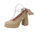 Women's beige Mary Jane shoes with a chunky heel, round toe, and a buckle fastening on the ankle strap.