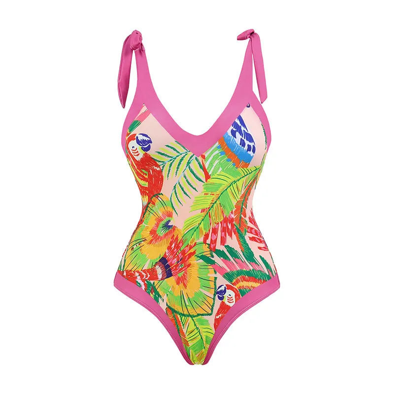 Women's pink floral print one-piece swimsuit with v-neck, covered belly, and attached thin skirt.