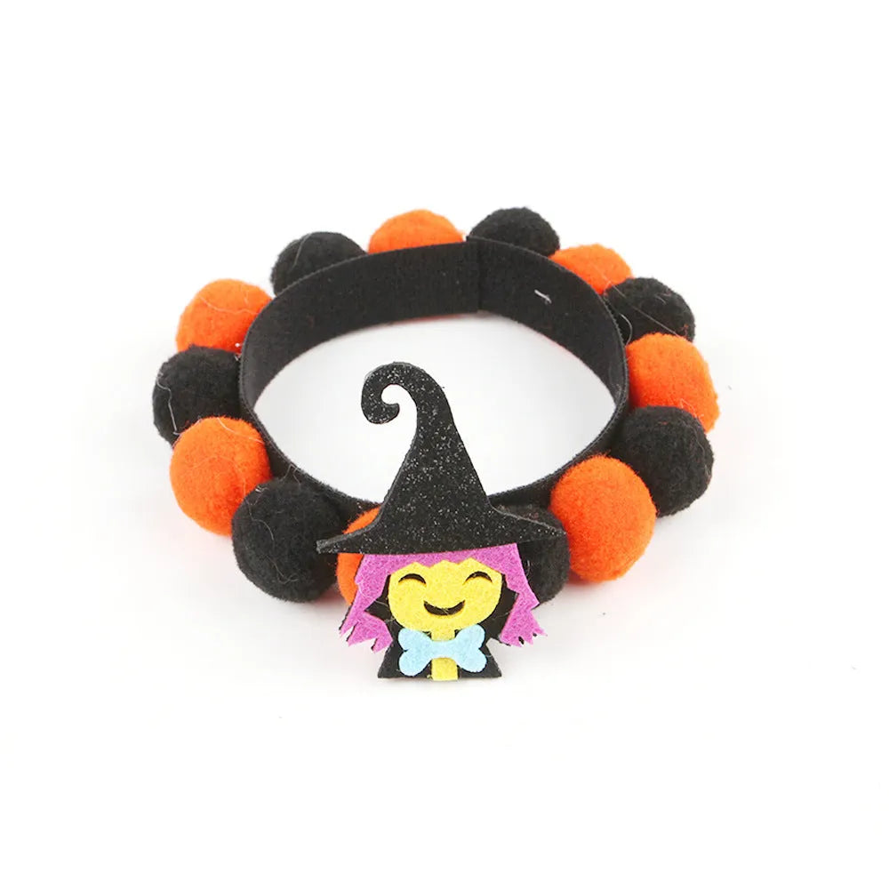 Halloween pet fur ball collar accessory for small dogs and cats in pumpkin, skull, and witch designs.