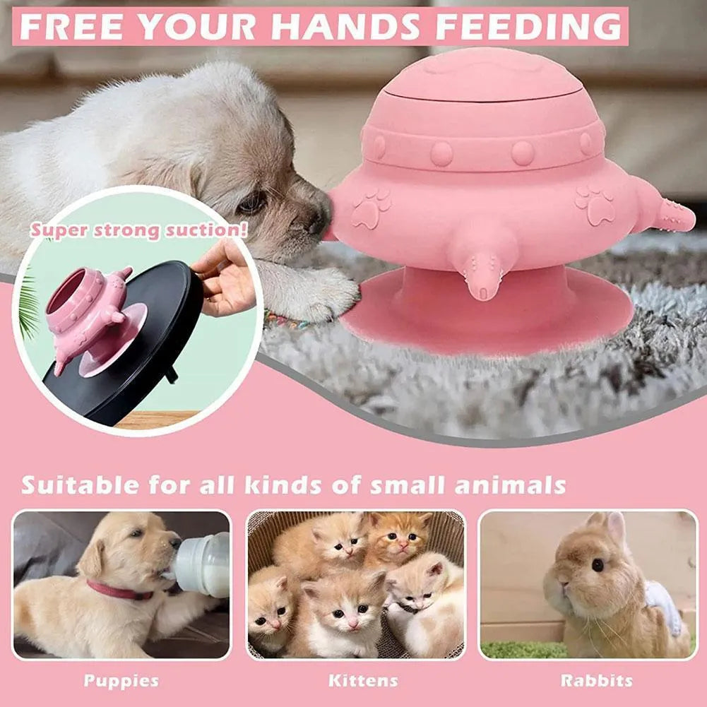 Pink silicone pet nursing feeder with bionic breast-shaped bowl and four pacifiers on a white background.