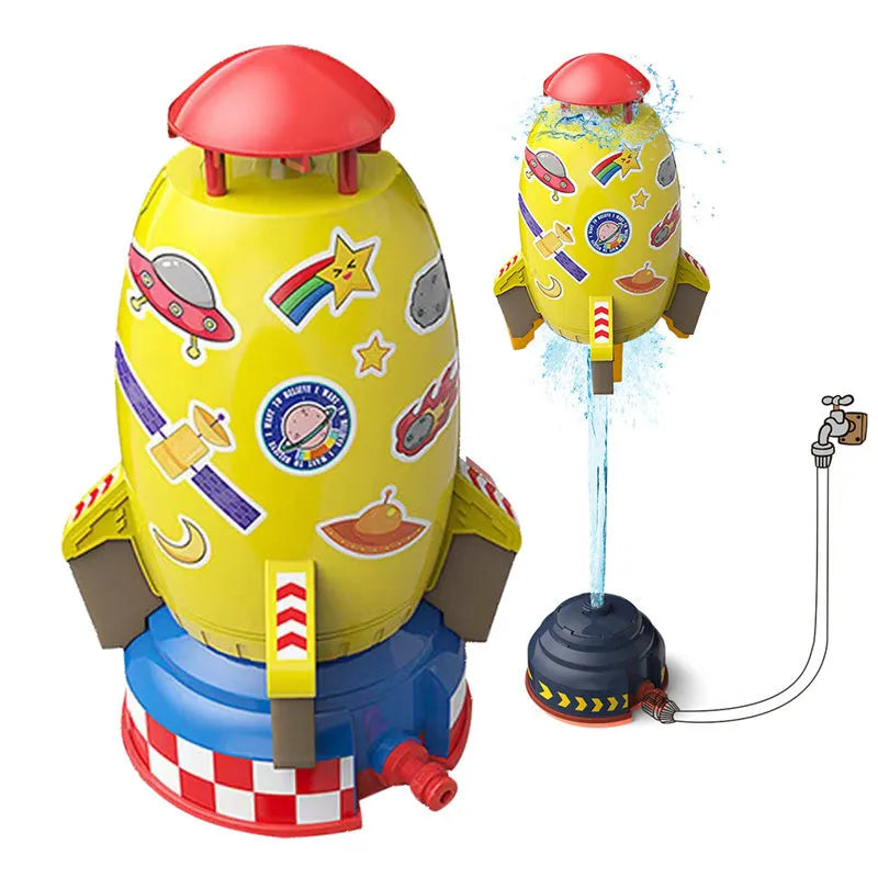 Water pressure rocket launcher toy on green grass with water spray, yellow rocket, and base connector