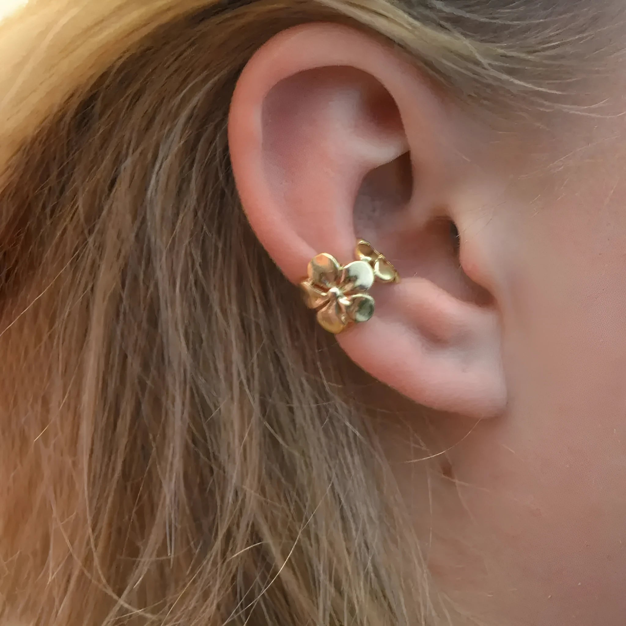 Gold electroplated starfish and conch shell drop earrings with beach style design