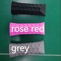 Silicone peak racket grip protective sleeve in black on a badminton racket handle