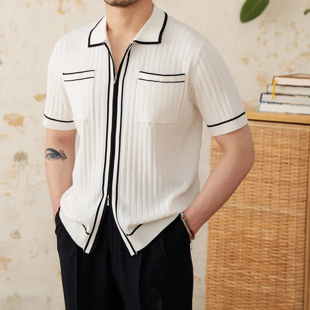 Slim-fit man's knitted polo shirt with a lapel collar and short sleeves in a black viscose blend fabric.
