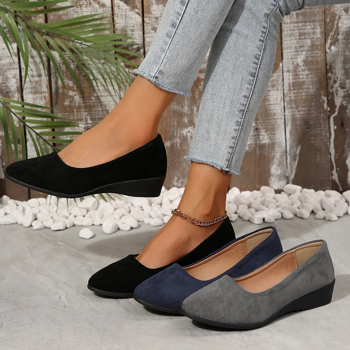 Women's suede wedge pump shoes in light brown with a low rubber sole and rounded toe.