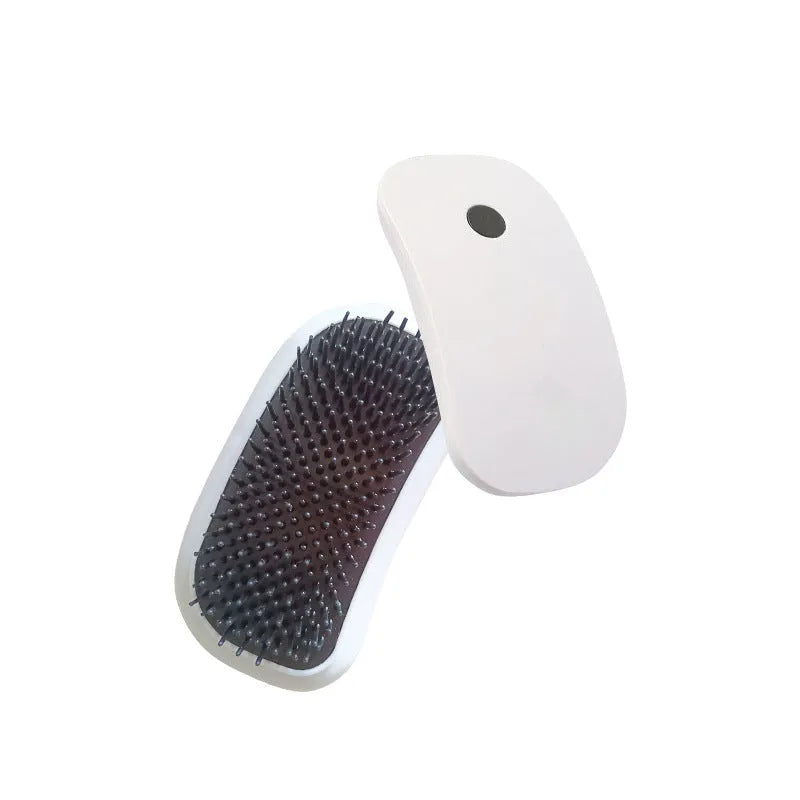 Light pink and white handheld electric pet massage brush with TPE teeth