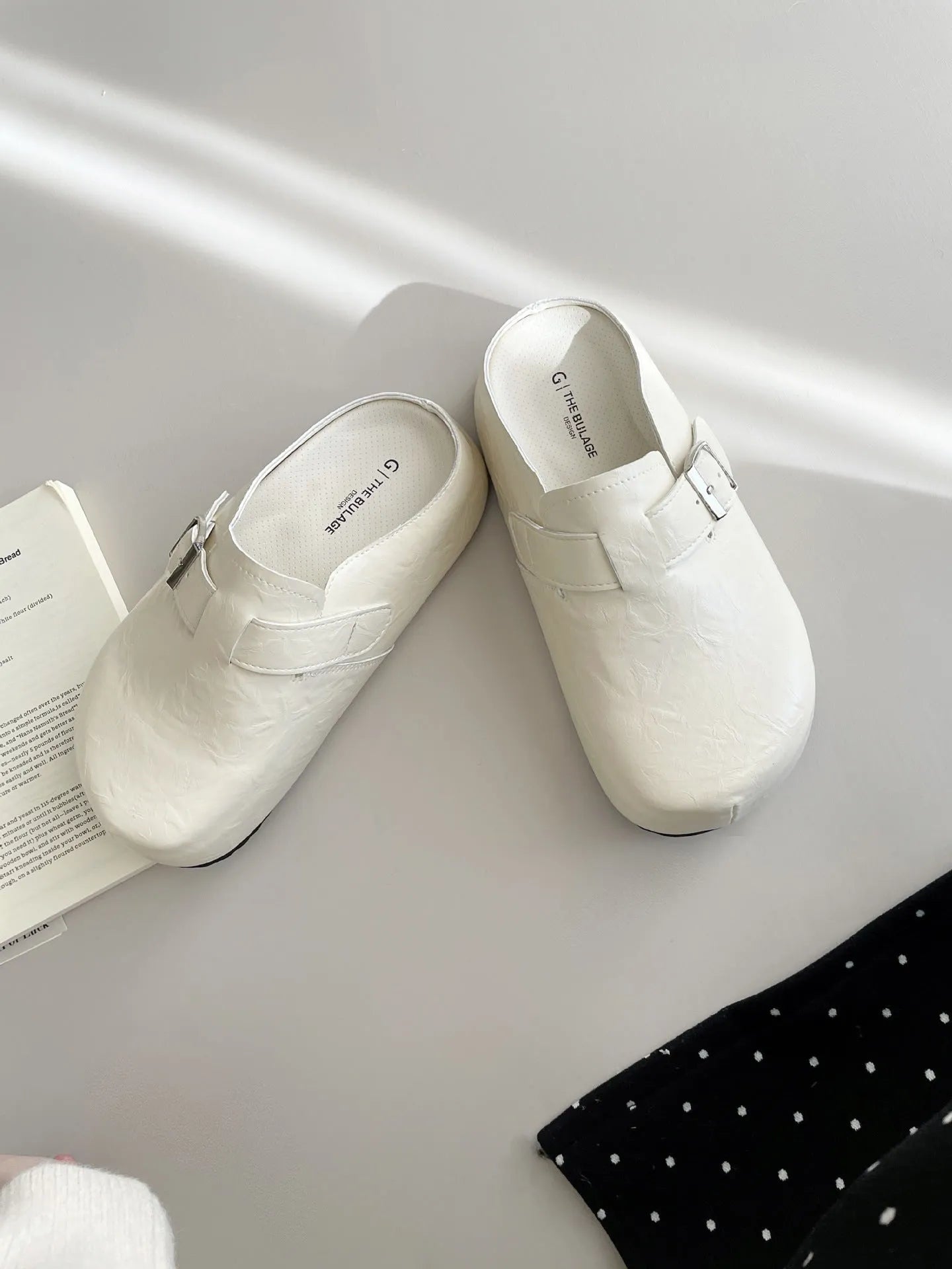 Women's flat buckle casual sneakers in yellow, creamy-white, silver, and black colours with round toe design