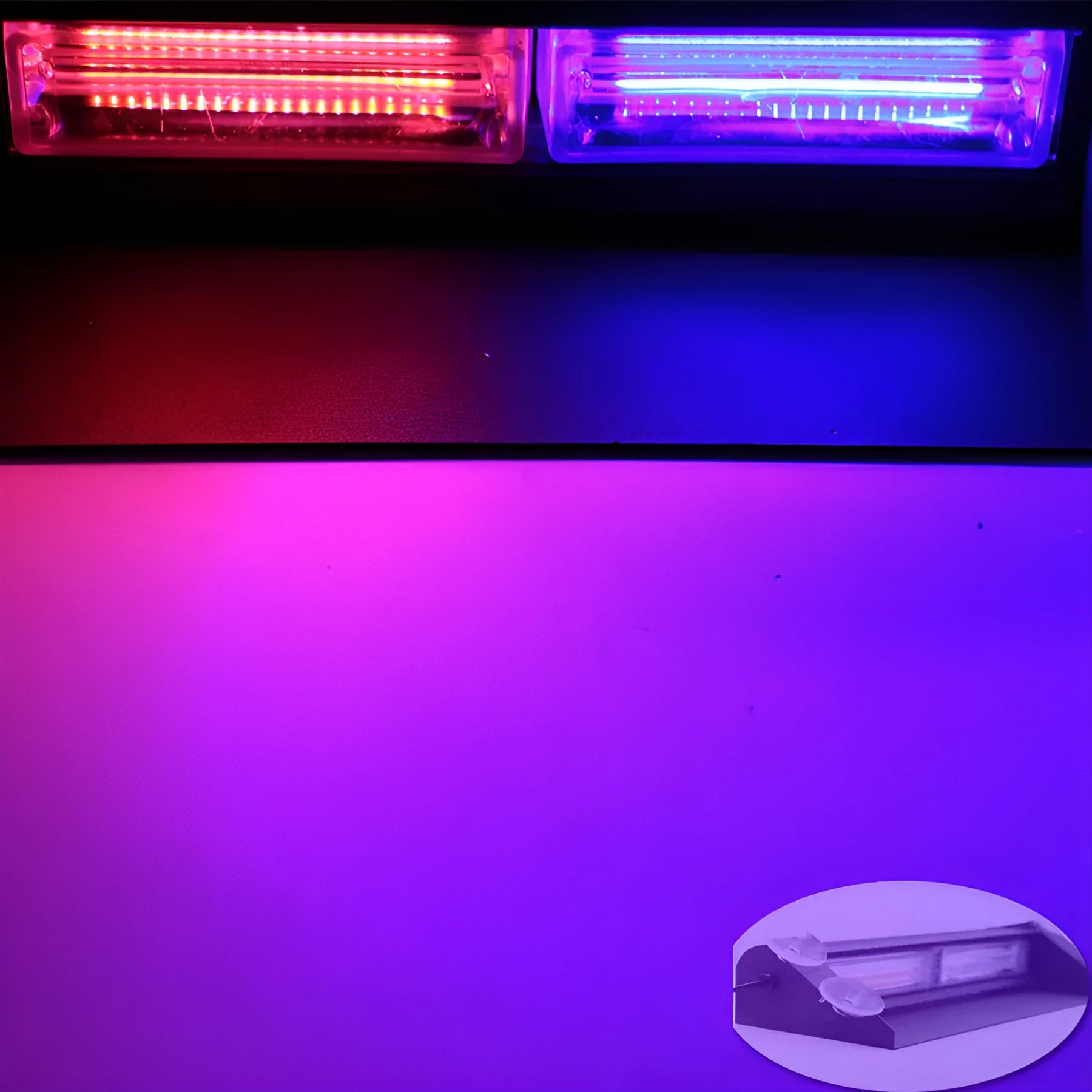 LED strobe light with aluminum housing and suction cup mount on a car windscreen