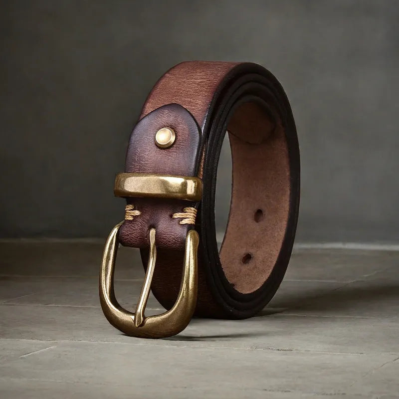 Men's black genuine cowhide casual belt with copper pin buckle on a jeans background