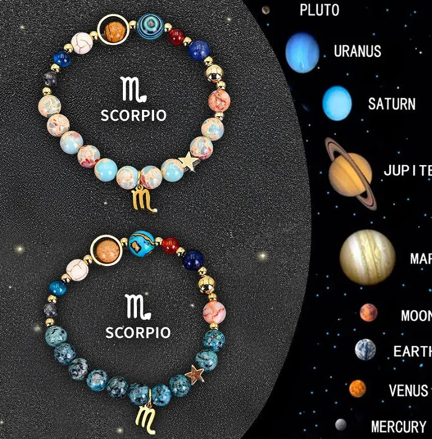 Two natural stone beaded bracelets on a table representing zodiac sign jewellery.