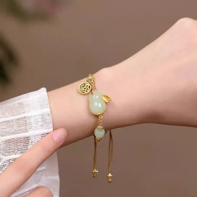 Hetian jade geometric rabbit charm bracelet on a yellow string for women