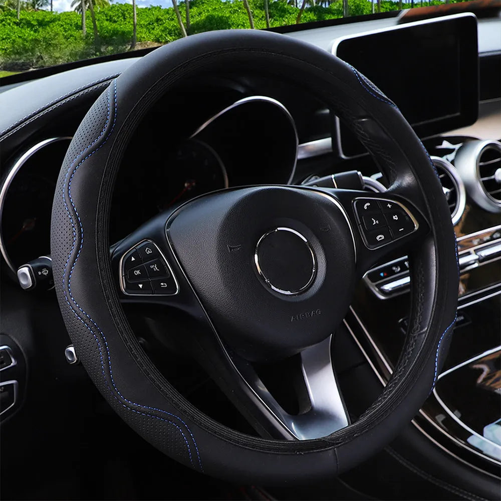 Black elastic steering wheel cover with corrugated texture, stretched to show fit on a 37-38cm wheel.