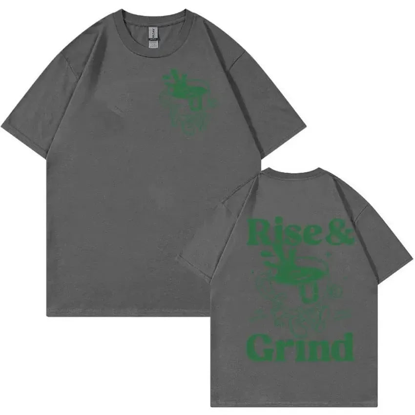Man wearing a loose black T-shirt with a colourful Rise and Grind coffee cartoon and expression bag graphic.