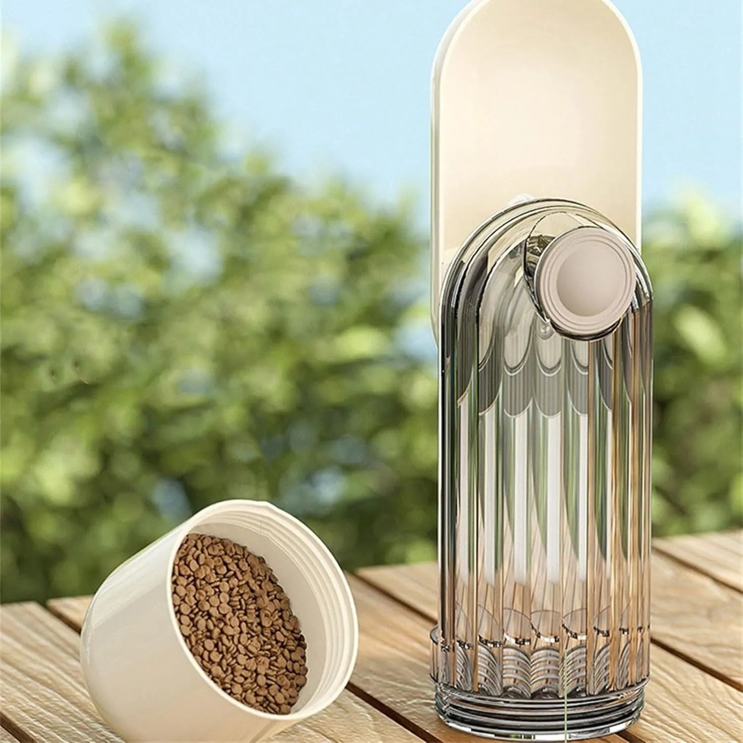 Beige foldable dog water bottle with food dispenser shown extended and collapsed for walking.