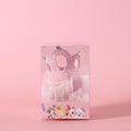 A cat wearing a princess crown headdress with a long, flowing veil for a wedding or celebration.