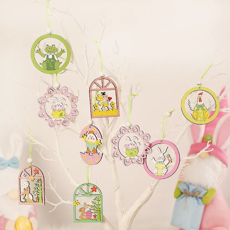Set of 9 painted wooden Easter pendants with bunny, egg, and owl designs on a light background