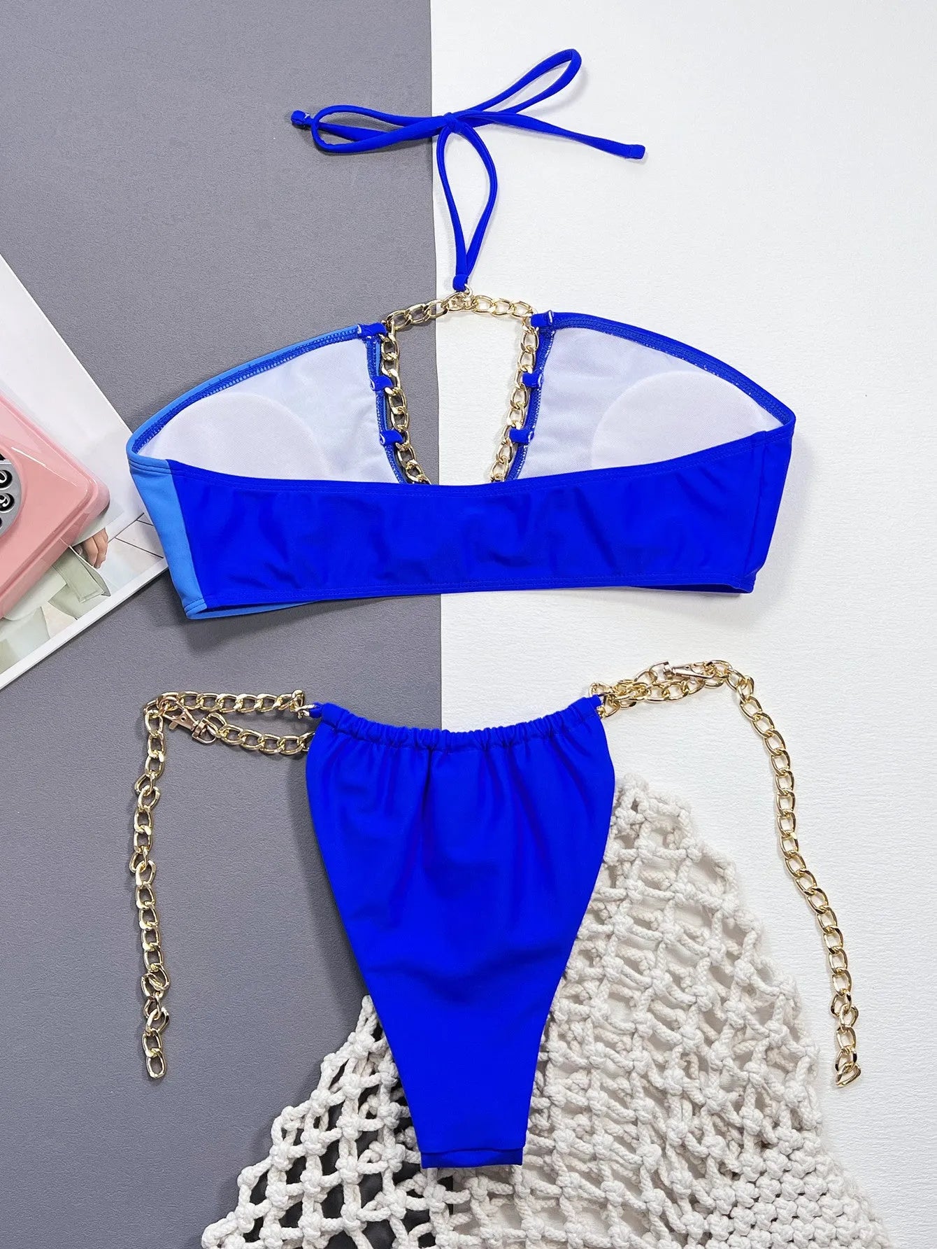Solid blue women's nylon bikini swimsuit on a white background