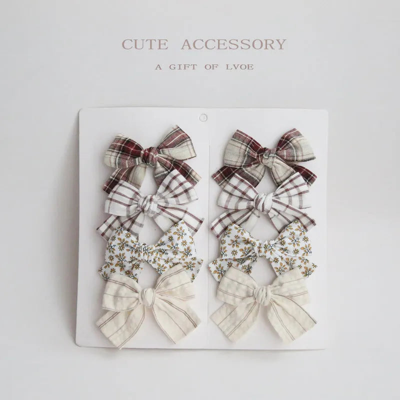 Children's cloth hairclips with dovetail bow decoration in multiple colour options