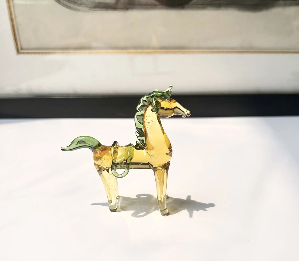 Brown glazed ceramic horse ornament on wooden shelf