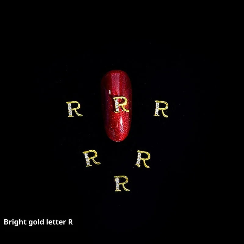 Gold alloy letter A nail ornament charm with crystal detail on a square chain base