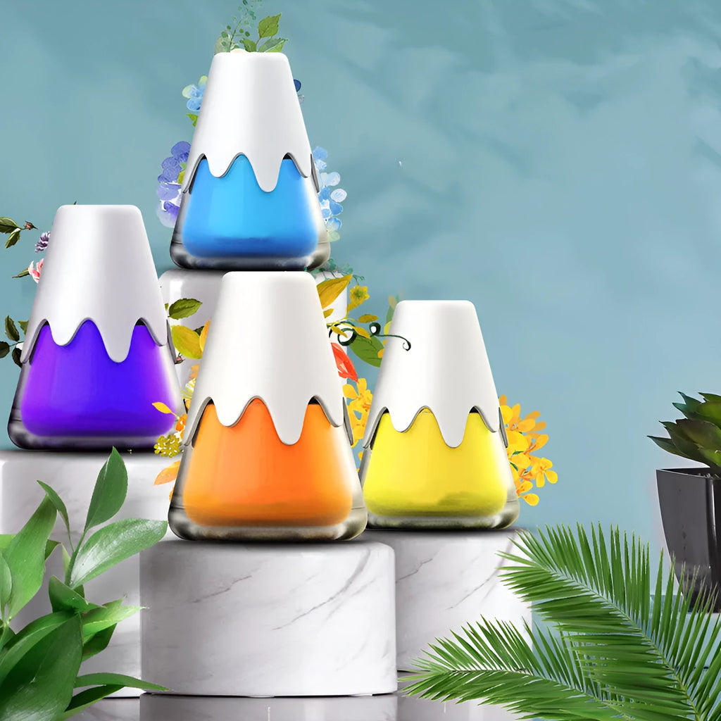 Snow Mountain Cup car air freshener in glass paste case showing four colour and scent options.