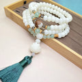 White Jade Bodhi 108-bead bracelet showing bead detail, available in three styles and sizes.