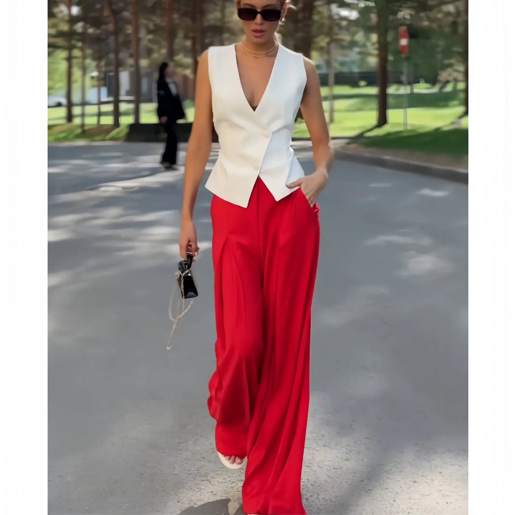 Women's beige polyester two-piece set showing sleeveless V-neck top with high-waist wide-leg trousers